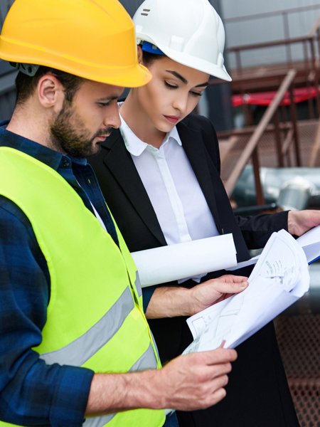 Construction professionals reviewing plans